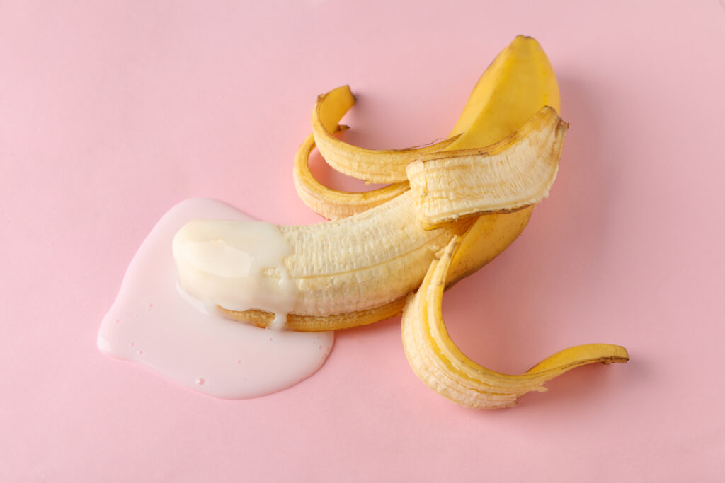 Banana on pink background. Fresh erotic fruit